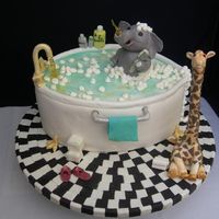 Ruba Dub All the details were made from chocolate. The cake was covered in MMF, and the tiles were also MMF. The water coming out of the faucet is...