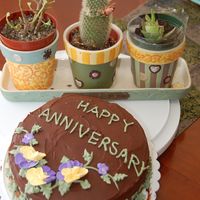 Anniversary Cake With Pansies I kinda threw this cake together. It was 8"round 3"high with chocolate ganache icing which really wouldn't set up... so I...