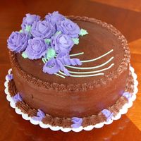 Wilton Course 1-Roses Cake Course 1 Final Cake, I chose to do a chocolate buttercream cake with purple roses. This was fun to do! Thanks for looking