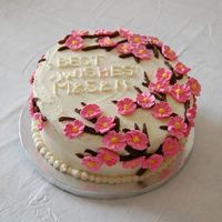 Cherry Blossom Cake This was a10" Round cake with white chocolate buttercream frosting, inside was pound cake with strawberries and ganache fillings in...
