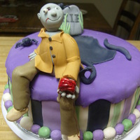 "zom-Body" Is Hungry! Made this cake for my brother who is a die hard fan of zombie movies. It had to remain on the cutesy side since my kids were wandering in...