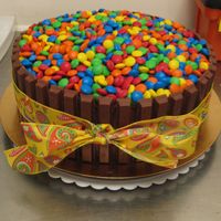 Got This Idea Here On Cc But I must say people absolutely freak out on this cake! And beware because it is REALLY hard to cut....plain M & M's seem to be...