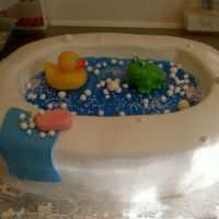 Duckie And Frog First cake I'm getting paid for...I only charged $35 then got carried away.....I'm $50 in the hole easy! All icing is buttercream...