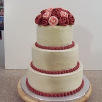 My Second Wedding Cake This is a 6", 8", 10" round. Buttercream with fondant ribbon roses.