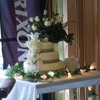 Cake Of Flowers White cake with real flowers and green ribbon