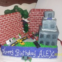 Incredible Hulk Smashes The City French vanilla cake with buttercream frosting. Rice crispy treat walls, real toy cars, real Hulk action figure.