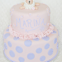 Baby's 1St Birthday Cake For a little girl who was turning one. Cake is banana chocolate and covered in pink and purple fondant with a fondant lamb.