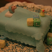 Baby Shower cake with buttercream and fondant bed and figure