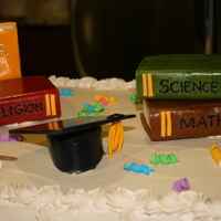 Graduation mocha cake with espresso whipped topping, books made up of rice krispies treats covered with fondant