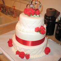 Anniversary Cake This was for my fiance's parent's 47th wedding anniversary. This was the first stacked cake I ever made. It's crooked but...