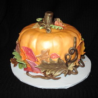 Pumpkin Cake Pumpkin spice cake with cinnamon cream cheese filling. Gumpaste leaves and twigs. Edible gold spray since I don't have an airbrush...