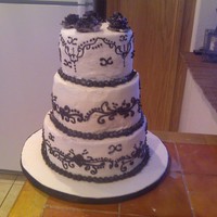Black And White Wedding Cake Cake night mare. All buttercream, black scroll work done in chocolate buttercream colored with black dye. I was so glad to be done with...