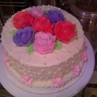 Course 1 Rose Cake My first "real" cake. Went a little over board on the dots, but overall, everyone at work couldn't believe it was my first...