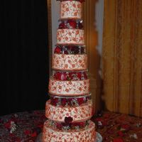 Nixon Giant This was a red velvet cake with cream cheese and strawberry filling with buttercream icing. The design matches the pattern on the table...