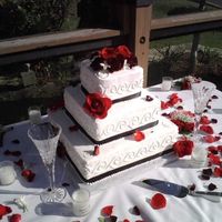 Black And Red Beauty This happens to be one of my favorite cakes that I have made. A simple wave design with satin black ribbon with Black Magic Roses. This...