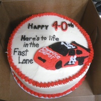 Life In The Fast Lane... Birthday cake for a co-worker...white cake with buttercream icing. Race car is frozen buttercream transfer.