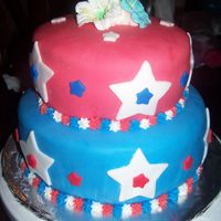 July 4Th Birthday Cake my first tiered cake, the blue flowers are mornign glories and the white ones are easter lilies