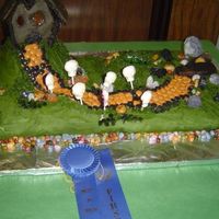 Haunted House! This was from several years ago - I made a haunted house cake every year for a long time, each one with a few more things going on, until...