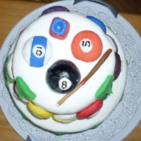 Billiards Themed Birthday cake with a billiards theme. Pool balls (except for the eight ball) are Nilla Wafers covered in fondant.