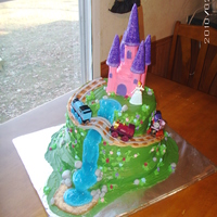Thomas The Train Meets Cinderella This cake was made for a little girl who loved Thomas the Train and Cinderella. She was having a birthday party with both characters, so...