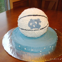 Unc Basketball Cake This is a round cake with a ball cake on top for the basketball made from the ball cake pan. It was iced with buttercream to look like a...