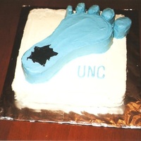 Unc Tarheel Foot Cake This cake is 2 layers. The foot is made of one layer. It is carved out and put on a square cake. It was very difficult to ice around all...