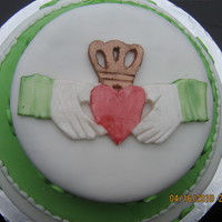 Irish Claddagh & Shamrocks I made this for a friends moms birthday. Everything is fondant and I used shimmer powder to paint the claddagh. The cake is devil's...