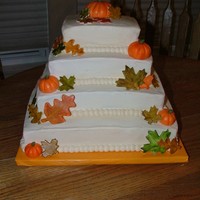 Fall Birthdays Pumpkin and caramel vanilla cakes covered in cream cheese buttercream frosting. The leaves are gumpaste and the pumpkins are MMF. This was...