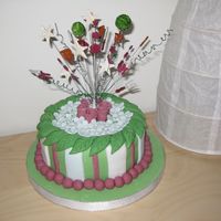 Gardening Cake Made this for my boyfriend's dad's bday. Did the cake at home, but the diddlers on wires at my cake class. The cake is normal...