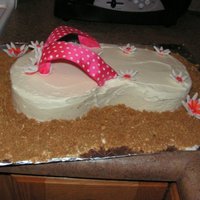 Flip Flop Cake The daisies are made of gum paste. Used store bought frosting, and the sand is graham crackers, with brown sugar mixed into it. I used wire...
