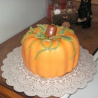 Pumpkin This is a chocolate cake. I made the cake in a bunt pan. I layered two cakes with chocolate frosting in between, I think add mini...