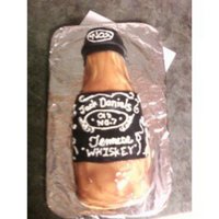 Whiskey Bottle I covered this in white chocolate plastic, then I used non colored piping gel, and tinted it myself for the liquor look.