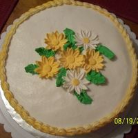 Yellow Daisies Class practice cake. White buttercream with yellow borders. The cake was yellow and had lemon filling. Family liked the combination of...
