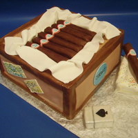 Cigar Birthday This was fun to do kind of surprise myself. Banana cake with butter cream icing covered in fondant, cigars, ash tray and cigarette lighter...