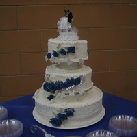 Butterflies this wedding cake is lemon cover in fondant, the roses were made with fondant. it took 4 days to make. I think i could have done better if...