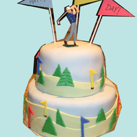 Golfing On Father's Day Fondant-covered golf themed cake showing the rolling hills and blue skies all golfers dream of!