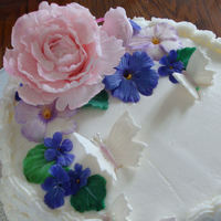 Flowers & Design Basketweave peony, pansies, violets and butterflies. Butterflies dusted with rainbow disco dust.