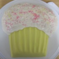 Giant Cupcake Basic sponge cake with buttercream, marzipan and ready bought rolled out icing on the bottom, home made royal icing for the top.