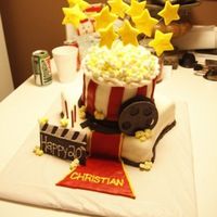 Movie Birthday Cake This cake was for my step brother's birthday. He is a big movie buff, and his mom asked me to make a movie-themed cake. This is my...