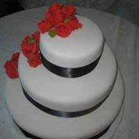 My First Wedding Cake French Vanilla WASC with vanilla buttercream, MMF, gumpaste roses and leaves with ruby pearl dust, black satin ribbon.