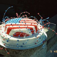 4Th Of July Cake butter cream with color flow stars on floral wires for 'fireworks'
