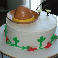 Mexican Themed Party Buttercream with 50/50 chili peppers and MMF sombrero. Inside the sombrero is cake as well.