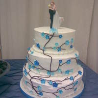 Blue Blossom Cake For a co-worker's wedding. She wanted cherry blossom's, but in blue. My first (and last!) wedding cake. Among other things, it...