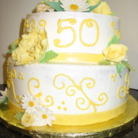 50Th Anniversary Cake This cake was 2 tier (8", 10"). BC with fondant/gumpast ribbon accent and flowers. This order was placed 1 week before she wanted...
