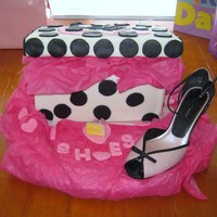 Shoebox Cake I tried several times to make a gumpaste shoe with no success...so I just put a real one on the cake! Shoebox is covered in MMF and the top...