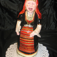 Singer Made the grandma for the bake sale in our Bulgarian orthodox church :). Three tiny tiers of cake :), fondant skirts and scarf, fondant+...