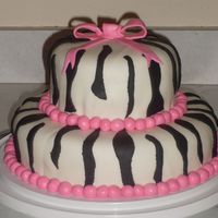 Zebra Pink And Black I made this cake to practice for a birthday cake I'm doing in a few weeks. I made marshmallow fondant for the white/pink and satin ice...