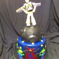 Buzz Light Year Cake All fondant Details. Buzz is made from Gumpaste and the moon is rice crispy treat and covered in fondant luster dust added ! :). Srry the...