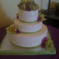 Triple Swiss Dot Wedding Cake The flowers they picked were incredible! Top tier is almond cake, buttercream, pineapple filling- middle tier chocolate cake with chocolate...