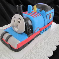 Thomas The Train Themed Cake This cake was hand carved. Everything was handmade and edible.